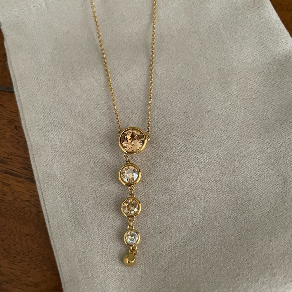 Swarovski pendant yellow and white crystal.